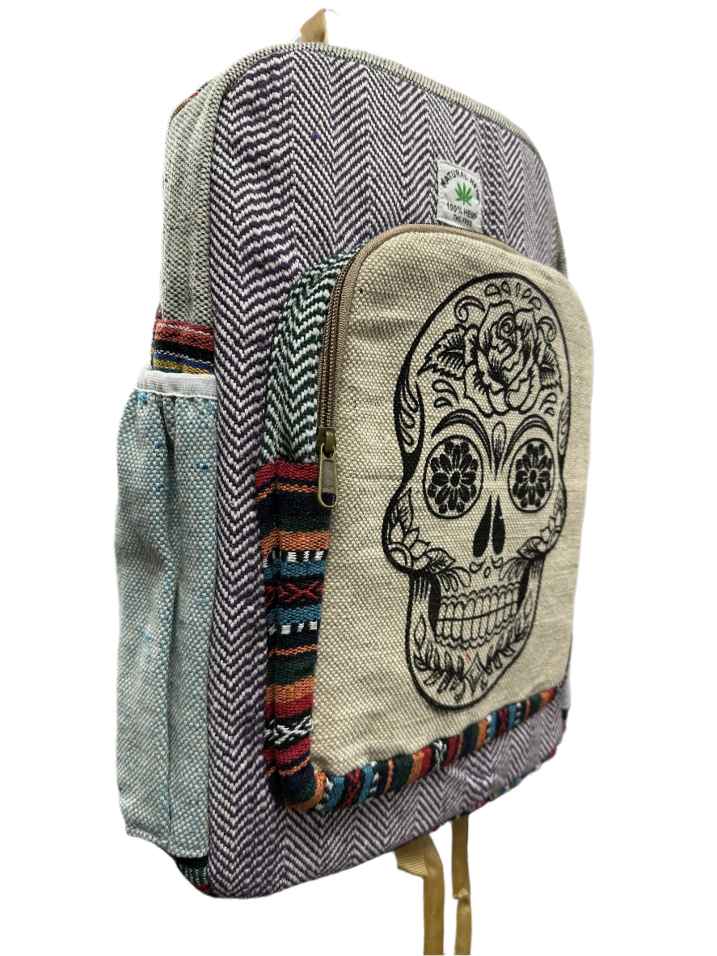 Pouch with skull design on a stack of bags.