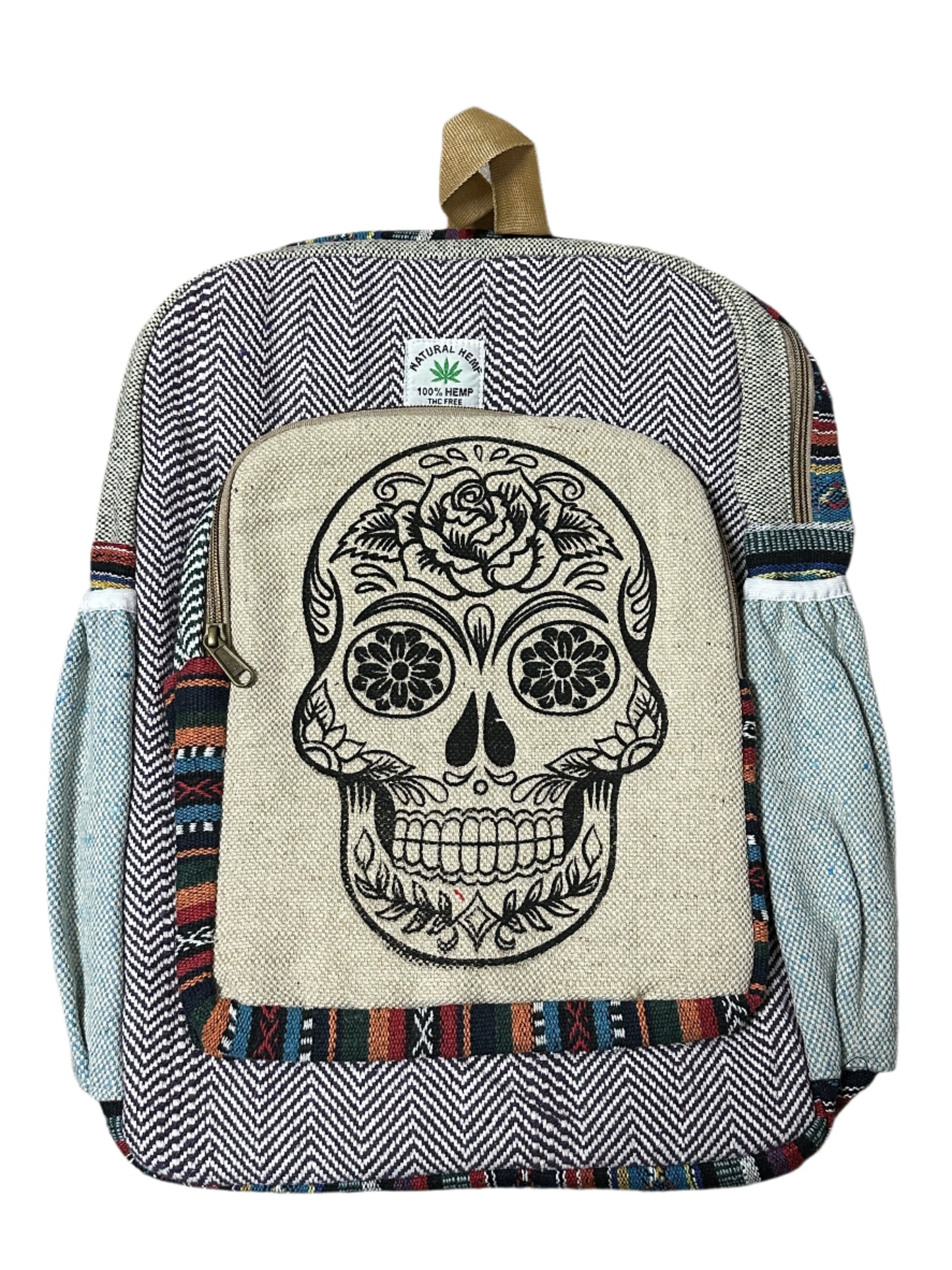A hemp backpack featuring a skull design on the front pocket, with a mix of striped and solid patterns on the rest of the bag.