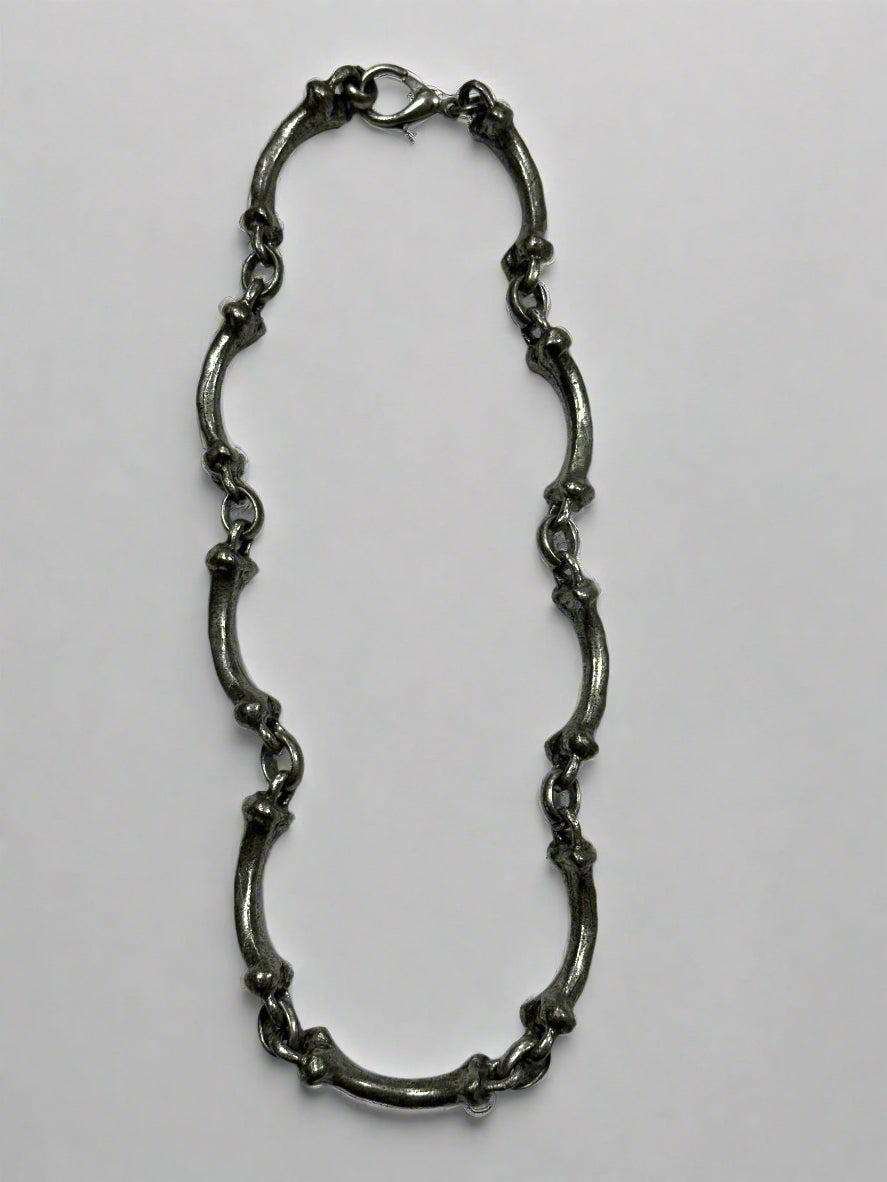 Silver chain on a light gray background