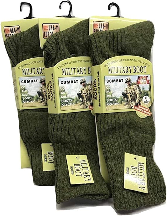 Three pairs of green military boot socks labeled for sizes UK 6-11 and EU 39-45, packaged in plastic with hanging hooks, designed for extended field operations.