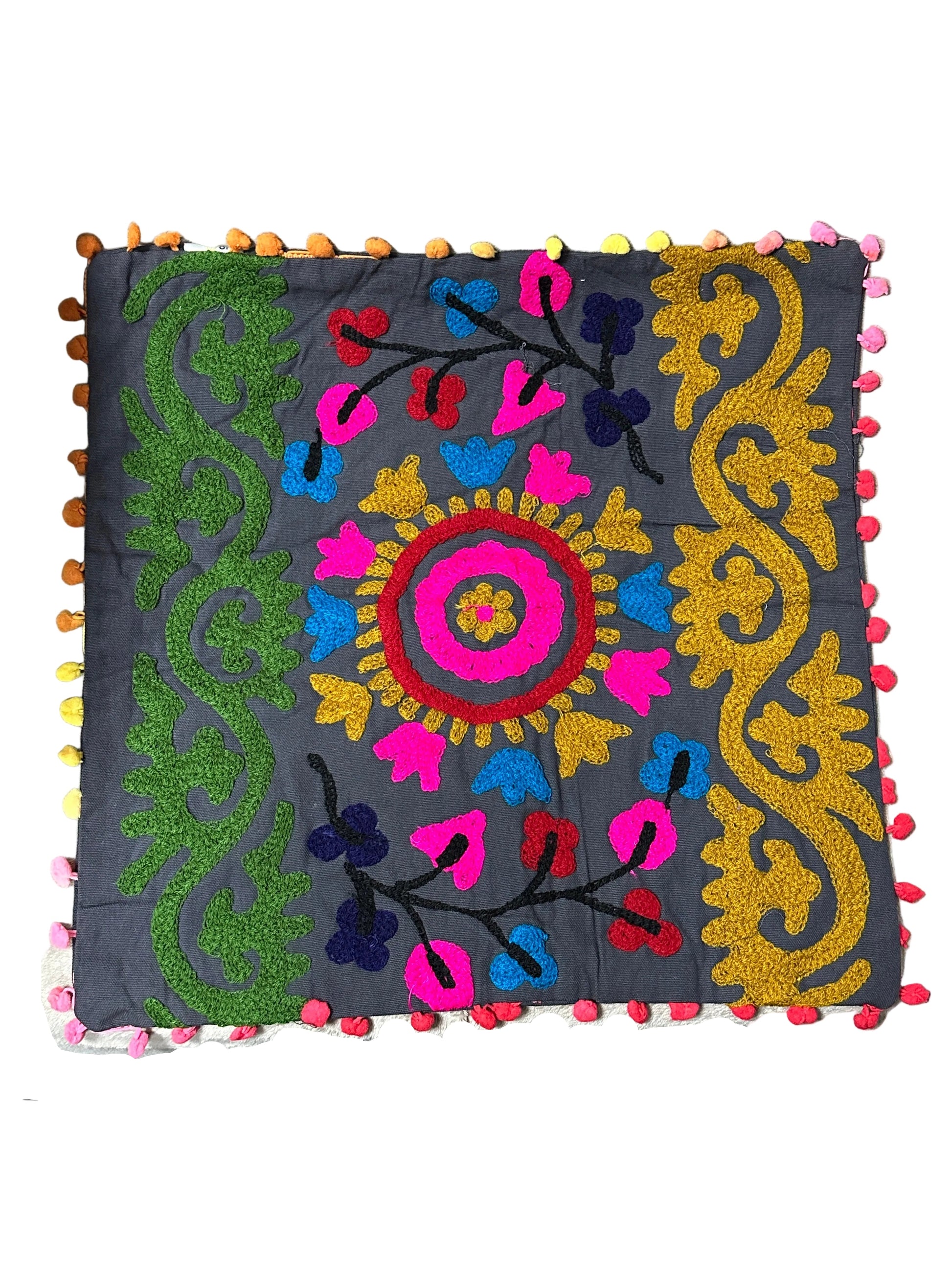 Decorative pillow with colorful embroidery on a plain background