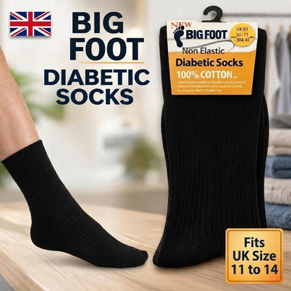 Black ribbed diabetic socks shown on a person's foot and in retail packaging, with large text reading 'BIG FOOT DIABETIC SOCKS' and a UK size callout. A real foot and blurred indoor setting are visible, so this is Lifestyle rather than Product/Packaging.