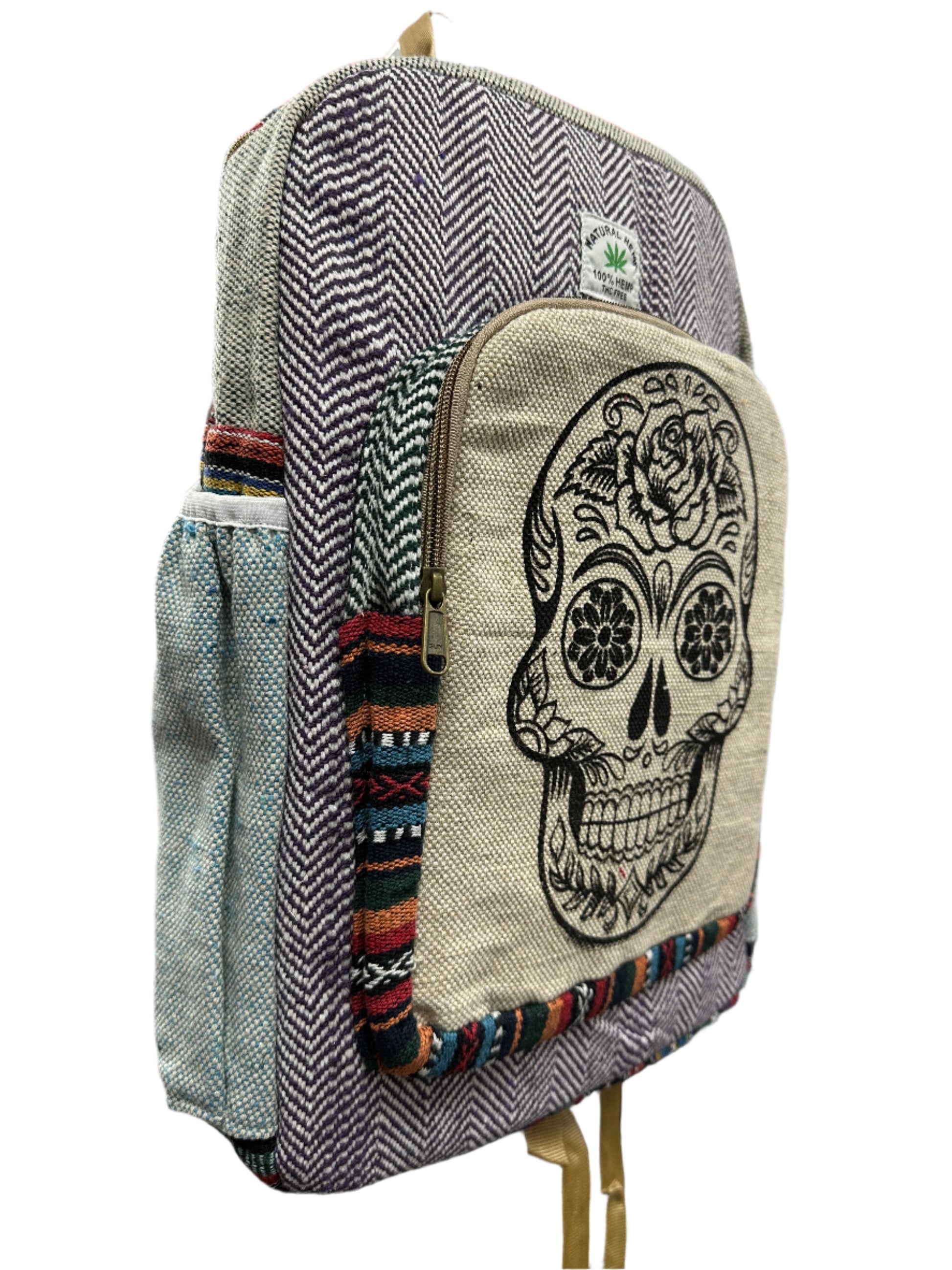 Pouch with skull design on a stack of bags.