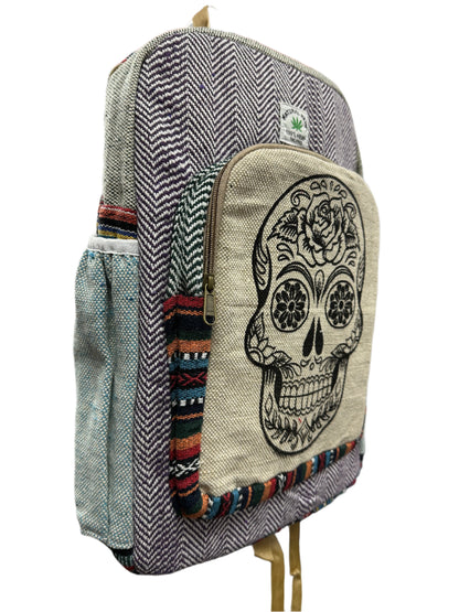 Pouch with skull design on a stack of bags.