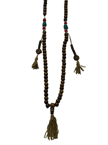 Decorative beaded necklace with tassels on a white background